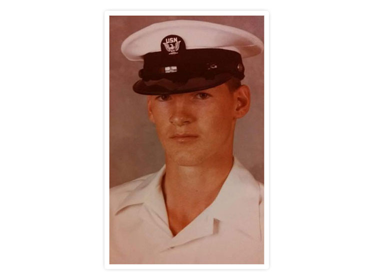 A photo of Willaim “Tom” Rogers in a Navy uniform. 